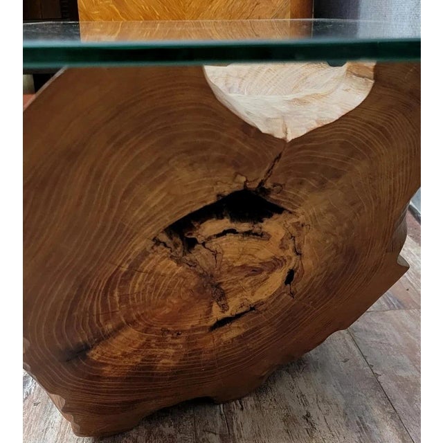 Vintage coffee table in wood and glass, dated 1999 / monogram and logo. It consists of a rectangular glass top resting on...