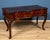 A refined Emilian-Ferrarese console table from the Louis XV period, made in the 18th century from fine walnut burl. The...