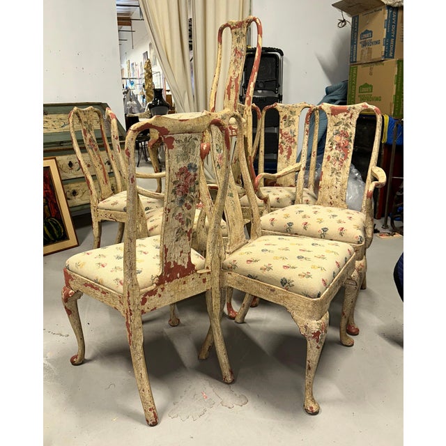 A wonderful set of 8 hand painted dining chairs with lovely needlepoint cushion seats in a floral pattern. There are 2 arm...