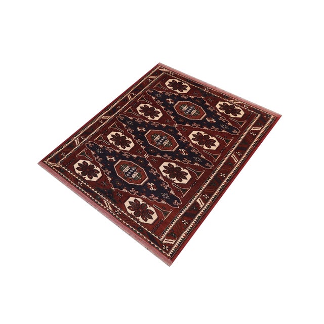 Enhance your home with the timeless craftsmanship of a hand?knotted Kargahi wool rug, celebrated for its tribal artistry,...