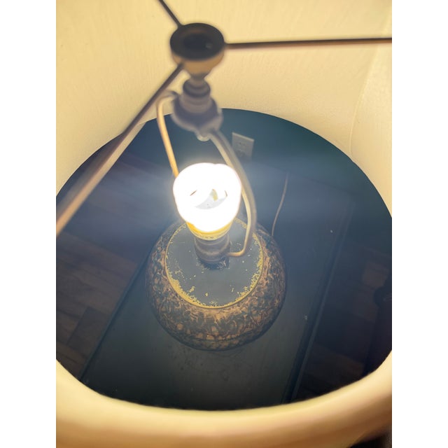 This Antique Persian Ceramic and Brass Fritware Jar Lamp is a vintage piece that exudes elegance and style. The brown...