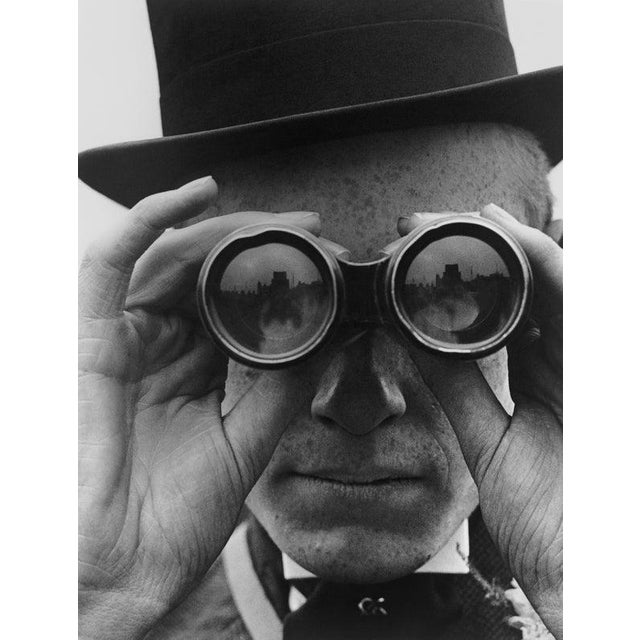 Derby Spectator A spectator looking through binoculars at the Derby horse races, Epsom, Surrey, June 1923. (Photo by...