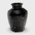 Originally used for fermenting rice or sorghum into vinegar, this earthenware vessel from the early 20th century is coated...