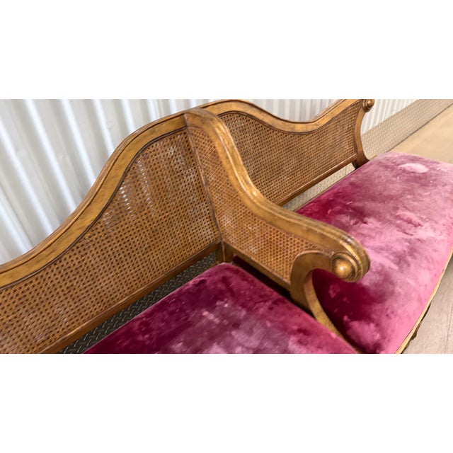 This is a very ornate gold double cane centrally divided Louis XV sofa. It extends 98" at the seat. The back and central...