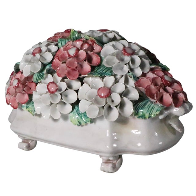 Decorative ceramic floral bouquet centerpiece bowl, Made in Italy circa 1920/50's. The white oval footed bowl is filled...