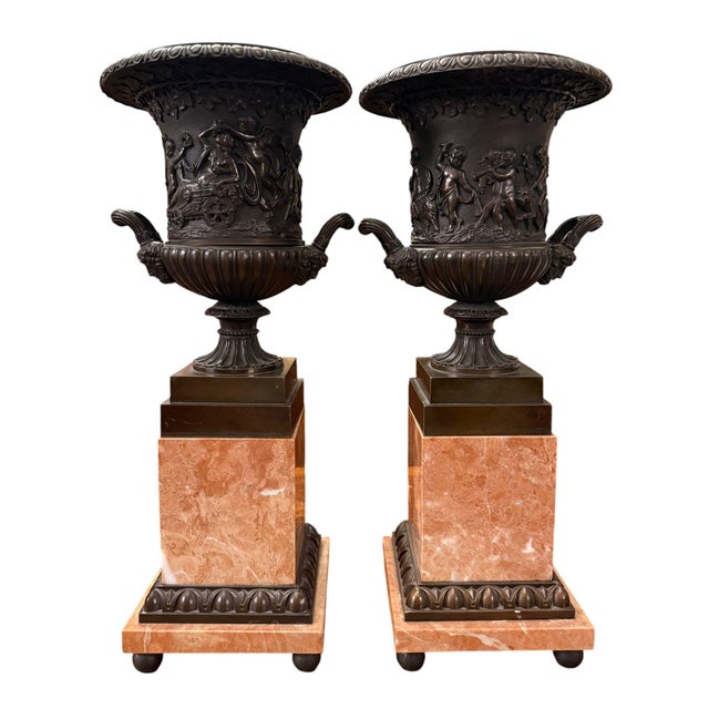 An impressive pair of 19th-century French patinated bronze vases, richly modeled with classical figural scenes and mounted...