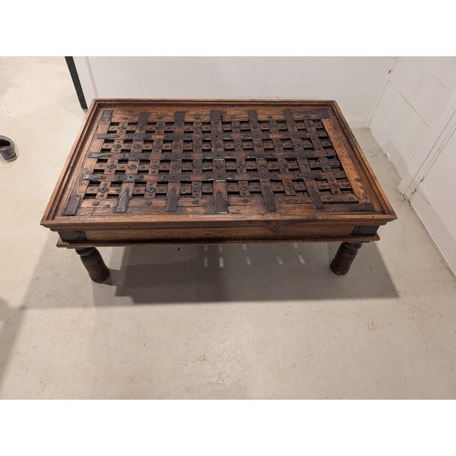 Rustic Late 20th Century Repurposed Indian Courtyard Door Coffee Table With Hand-Forged Iron Hardware & Glass Top For Sale - Image 3 of 6