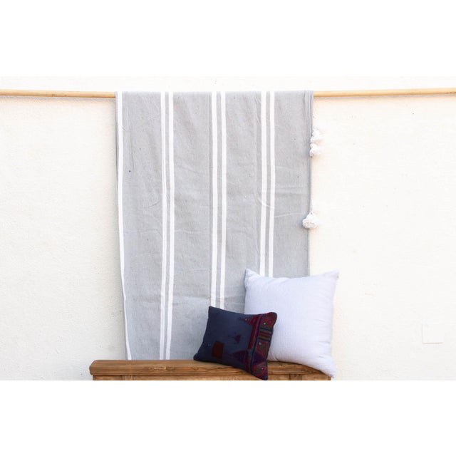 While the camel stripe speaks of the desert, this Soft Grey and White variation evokes the coast—specifically the misty,...