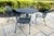 MCM cast iron mesh round table grapevine motif and 4 chairs. Woodard replica. Each chair has rounded backrest and...