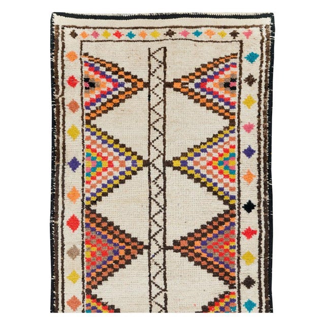 A vintage Turkish Anatolian runner handmade during the mid-20th century. Measures: 3' 1" x 10' 9".