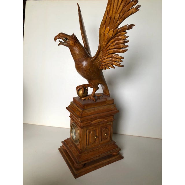 Super unique carved eagle sculpture with inset clock to base. Made in the early 20th century.