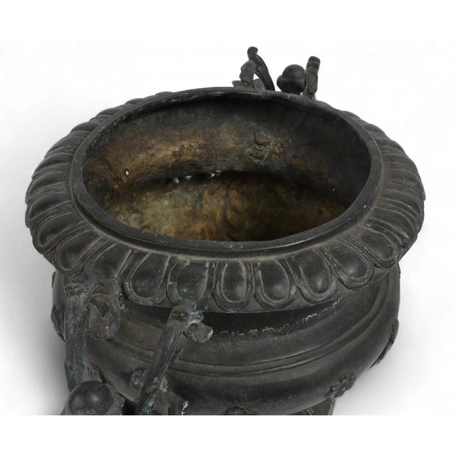 This early 20th C neoclassical patinated bronze urn has that time earned patina and age that make it a one of a kind piece...