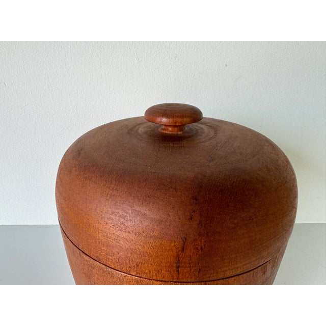 Available for sale this fantastic Vintage sculptural teak wood ice bucket with white plastic interior. This vintage ice...
