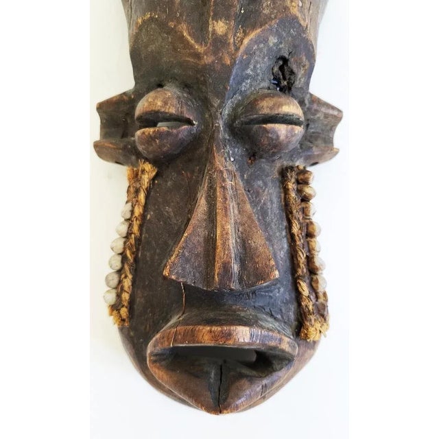 from a Senegalese collection, mid-20th century. Beautiful details of woven shells and raffia. Good vintage condition with...