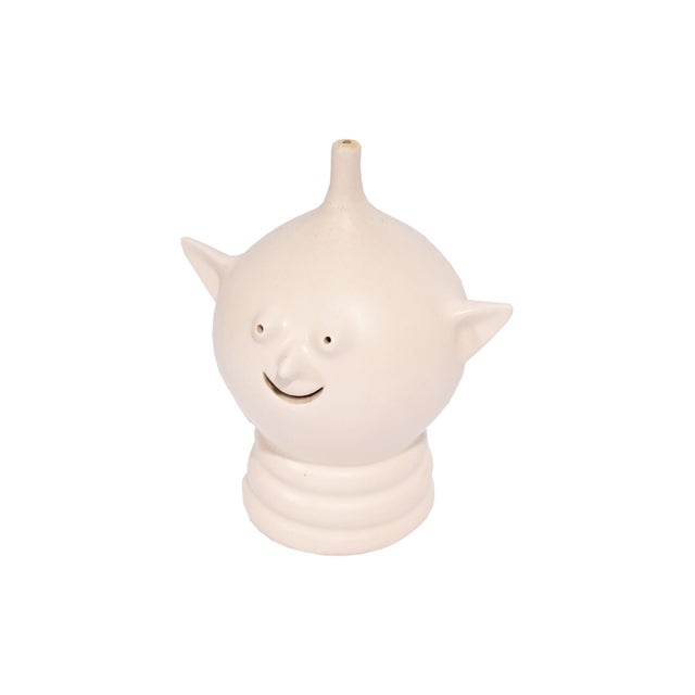 A ceramic coin bank designed by the American artist and designer Malcolm Leland (born 1922) for NS Gustan. This coin bank...