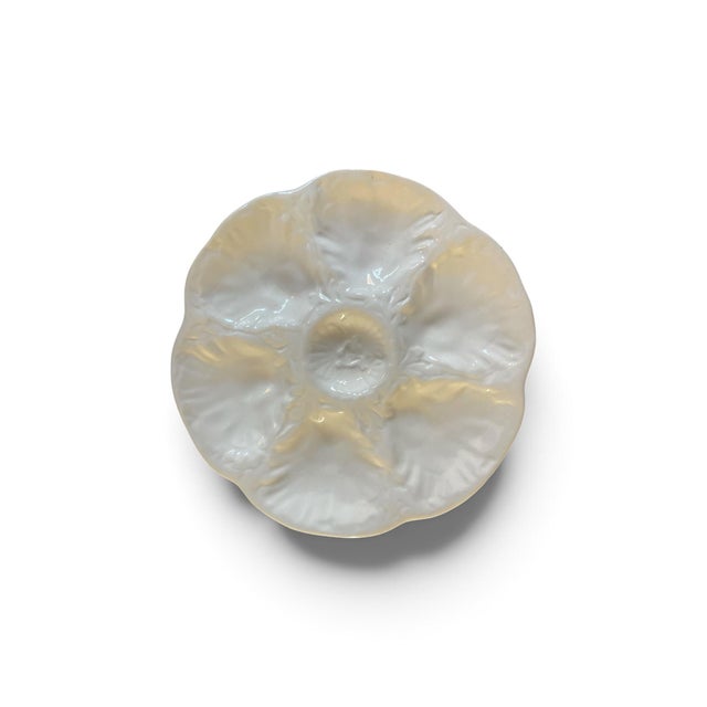 Bring classic French coastal elegance to your table with this stunning set of six vintage mid-century oyster plates....