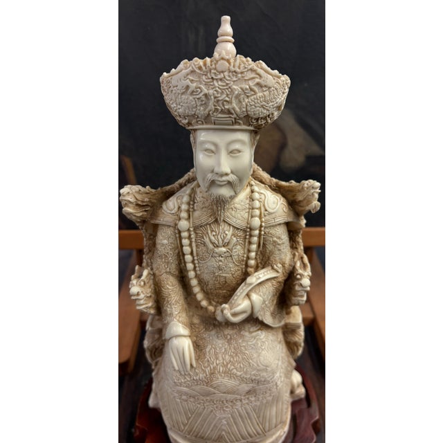 Offered here is a striking matched pair of Chinese imperial court figures, depicting an Emperor and Empress seated upon...
