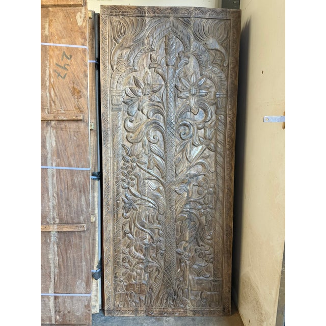 Bring soulful artistry and symbolic beauty into your space with this hand-carved Tree of Life wooden barn door panel,...