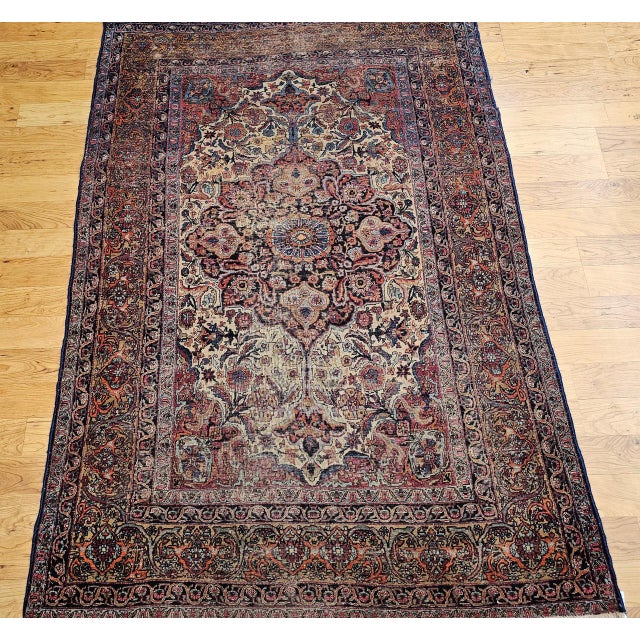 "This exquisite 19th century Persian Kashan rug is a true testament to the artistry and craftsmanship of one of Persia's...