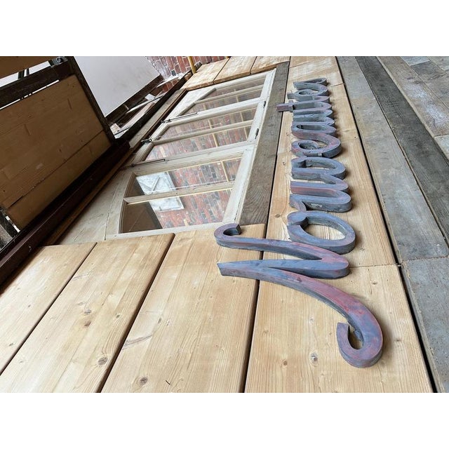 This lettering has retained its original patina. It is in good overall condition. The word is divided into 3 parts for...