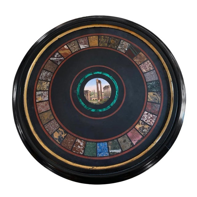 Grand tour pedestal side table Mosaic with stone specimen boarder and central painting. Black with gilt accents Top with...