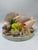 This is a vintage coastal-themed shell sculpture featuring a miniature seaside scene. It is arranged on a round base and...