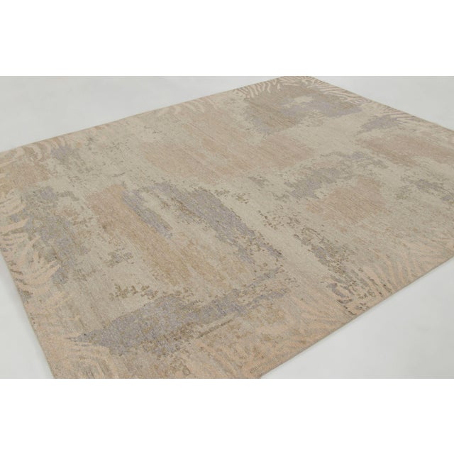 Hand-knotted in wool, this 8x10 contemporary rug joins Rug & Kilim’s Modern collection. It features a high-low cut pile...