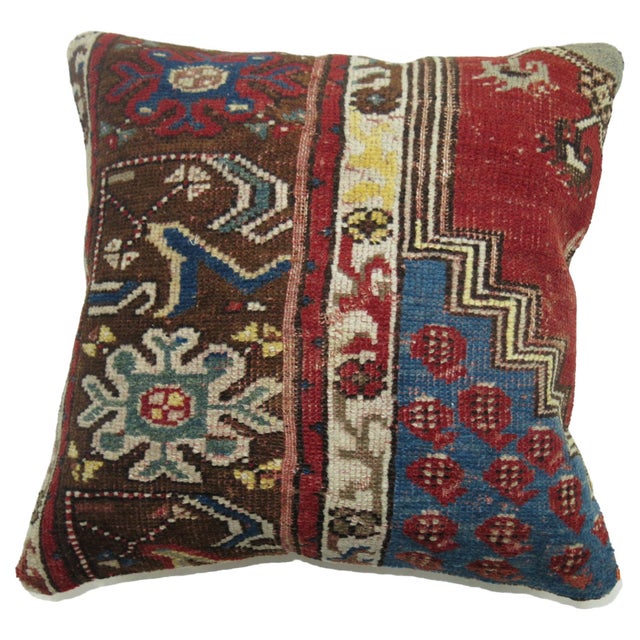 Pillow made from a vintage Turkish rug in reds and blues 17'' x 18''