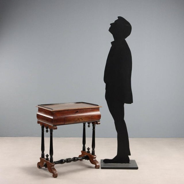 Poplar work table with a walnut stain. Folding top conceals open compartments, hidden compartments, and a drawer. Turned...