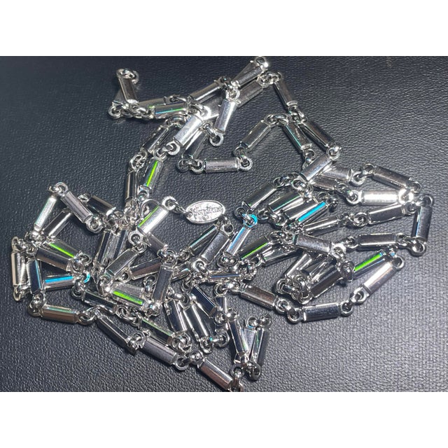 Authentic vintage silver-tone station chain necklace by Vendôme. Features geometric bar/cylinder links connected by open...