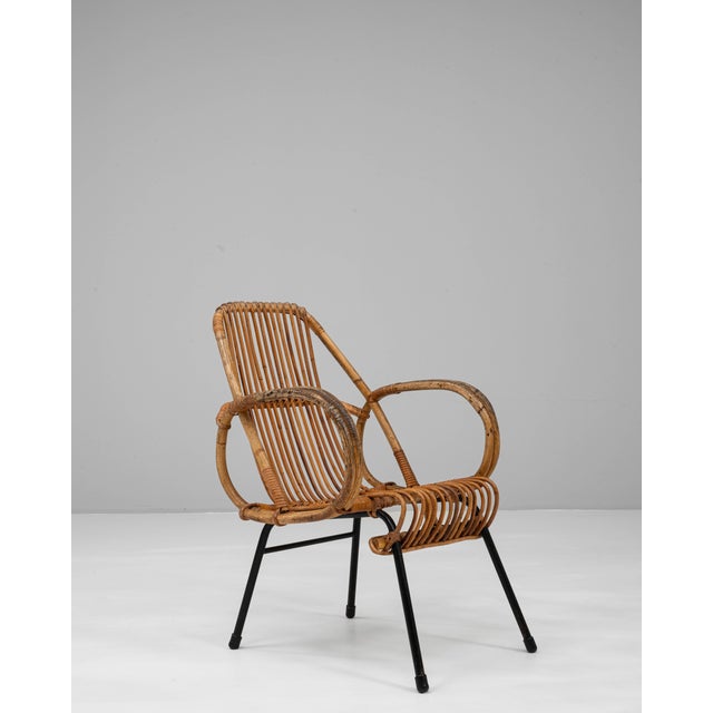 This 20th Century French bamboo armchair combines organic warmth with a light, sculptural silhouette, making it a charming...