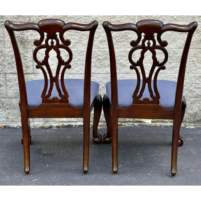 Gorgeous pair of Ethan Allen Georgian dining chairs. Features an intricately carved pieced back , upholstered seat and...