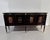 Elegant Italian Midcentury Black lacquered side board with bar cabinet with four doors ornate with brass . Each door with...