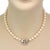 This is a vintage pearl necklace, the clasp is crafted from 14k white gold featuring an old style design with diamond and...
