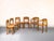 Six-piece set of solid wood chairs in the style of Rainer Daumiller. Made of lacquered pine, consisting of two chairs with...