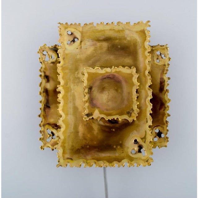 Svend Aage Holm Sørensen, Denmark. Two wall lamps in laser-cut brass. 1960's. Measures: 21.5 x 20 cm. In very good...