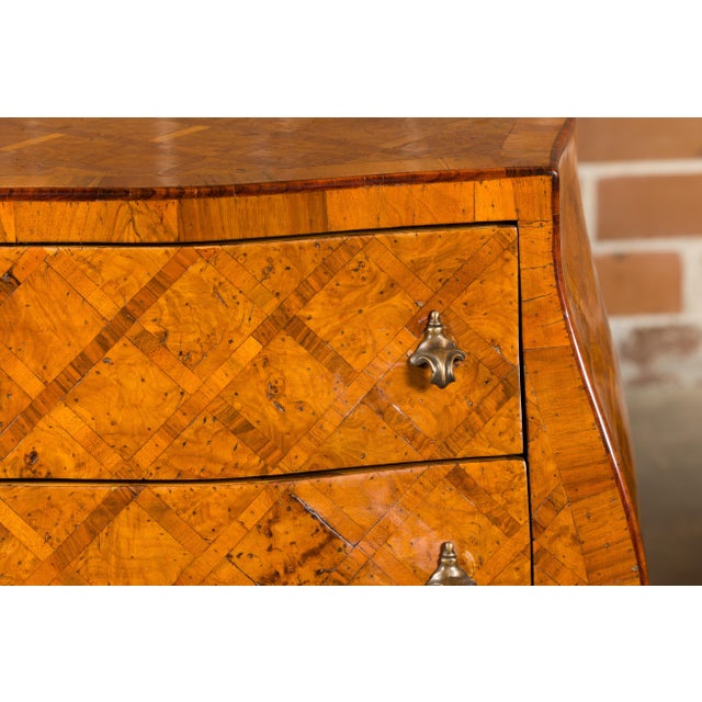 A pair of Italian Rococo style burl wood bedside chests from the Midcentury period, with two drawers, marquetry décor,...