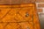 A pair of Italian Rococo style burl wood bedside chests from the Midcentury period, with two drawers, marquetry décor,...