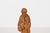 Vintage hand-carved wooden folk figure of a Quebec elderly woman carrying a basket. Carved from honey-toned wood with...