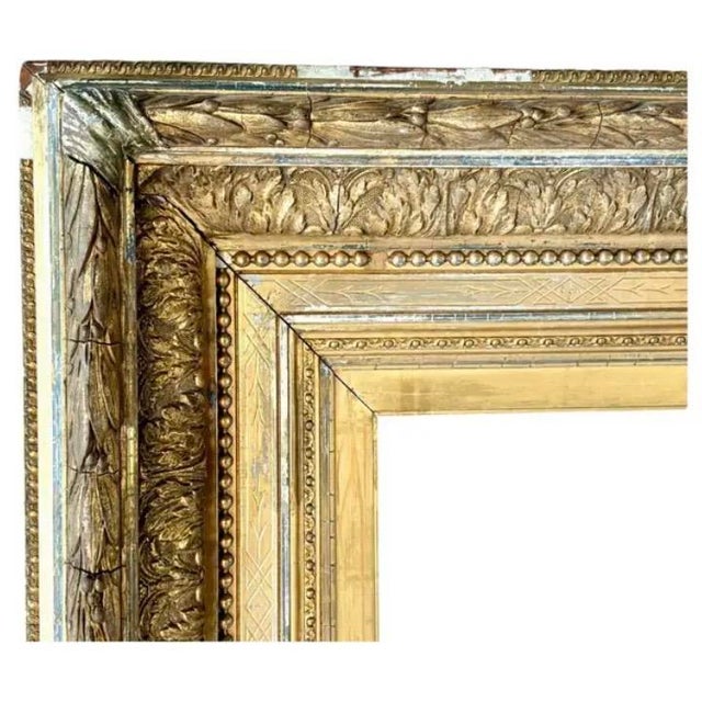 Large 19th Century Giltwood Wall or Overmantel Mirror. Mirror features a rectangular form with classic beaded inner...