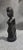 This beautifully hand-carved ebony wood sculpture depicts a graceful kneeling female figure with finely detailed facial...