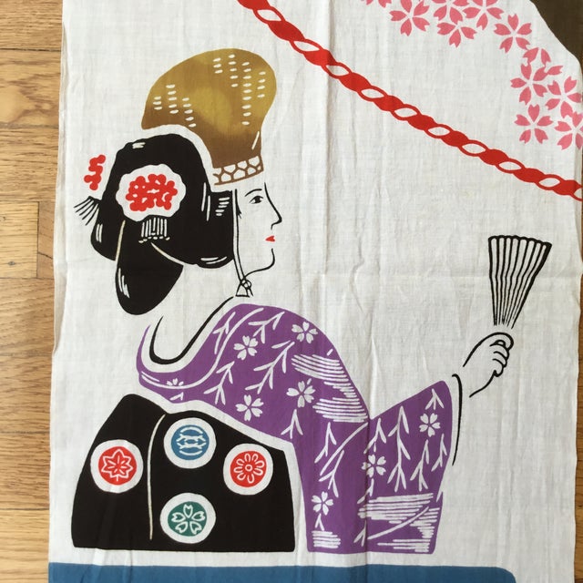 This is a screen printed fabric panel that features a geisha and a cherry blossom tree. It is a promotional piece for...