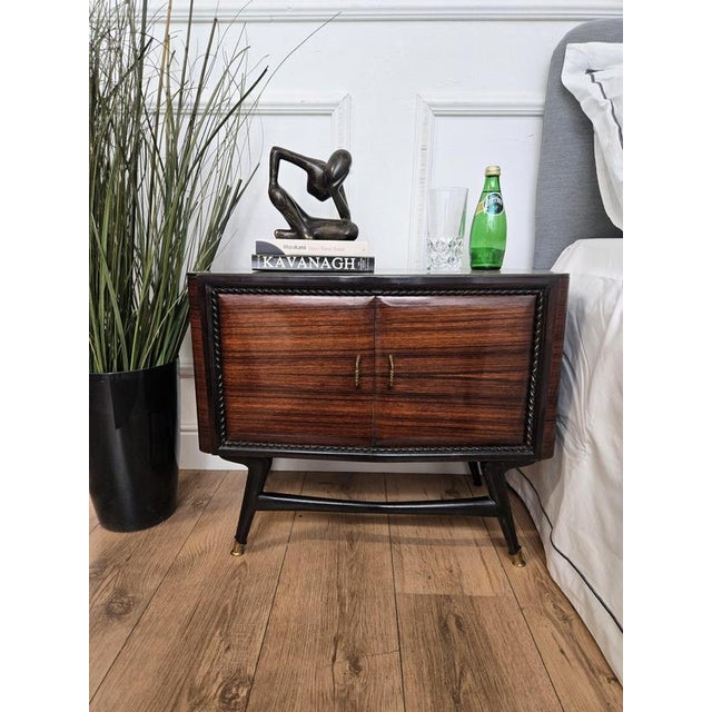 Very elegant and refined Italian 1950s Mid-Century Modern design, pair of bedside tables with double front door, light...