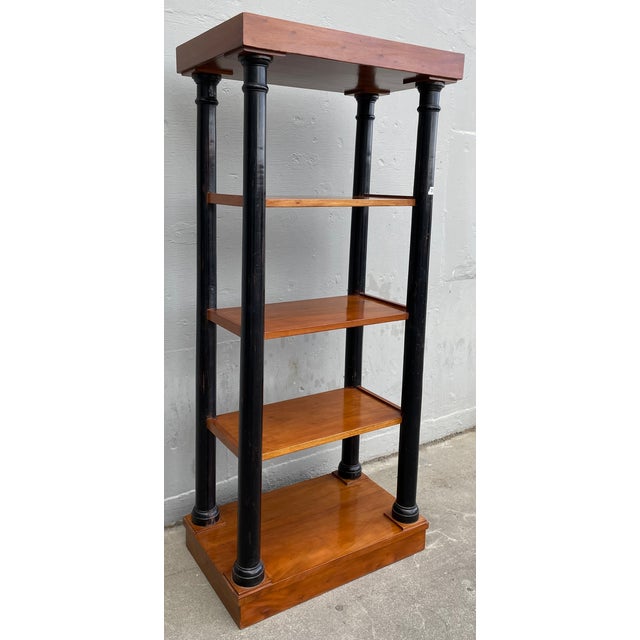 This is a classic four tired antique etagere ideal for displaying your precious objects or book collection.