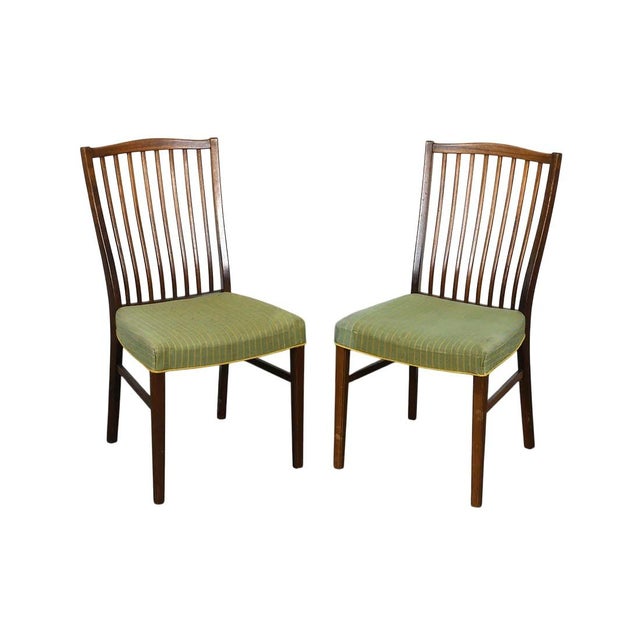 A very appealing set of 8 Danish mid century modern teakwood dining chairs. The chairs have a wonderful look and would...