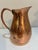 Vintage Gorham hammered copper pitcher featuring a classic bulbous silhouette with hand-hammered finish, flared pouring...
