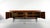 Important rosewood credenza by Danish designer Ib Kofod-Larsen. Crafted in solid rosewood and rosewood veneer, it features...