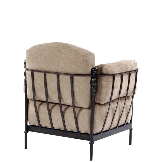 An outdoor armchair from the Montecito Collection by Michael Taylor Designs. With its bronze-finished metal frame,...