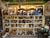 A substantial primitive wooden display cabinet originating from a general feed store, believed to date to the 1940s. With...