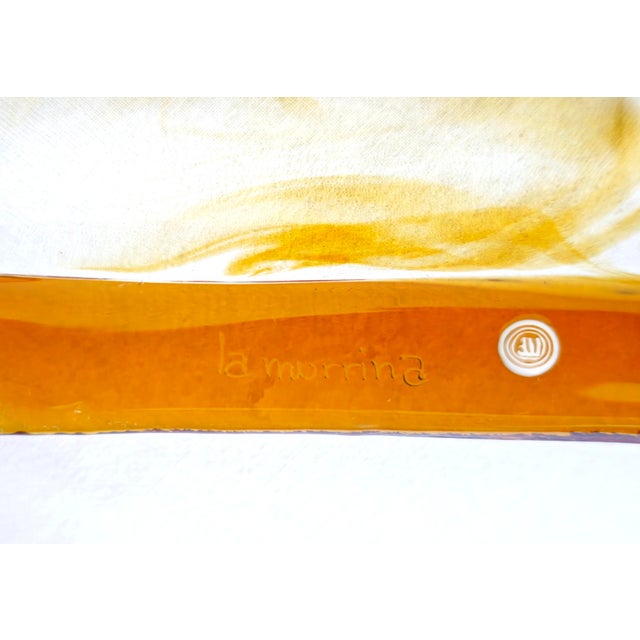 A square centerpiece emptier in authentic Murano glass, crafted by the renowned Italian glassworks La Murrina and dating...